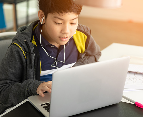 boy learning english on a computer