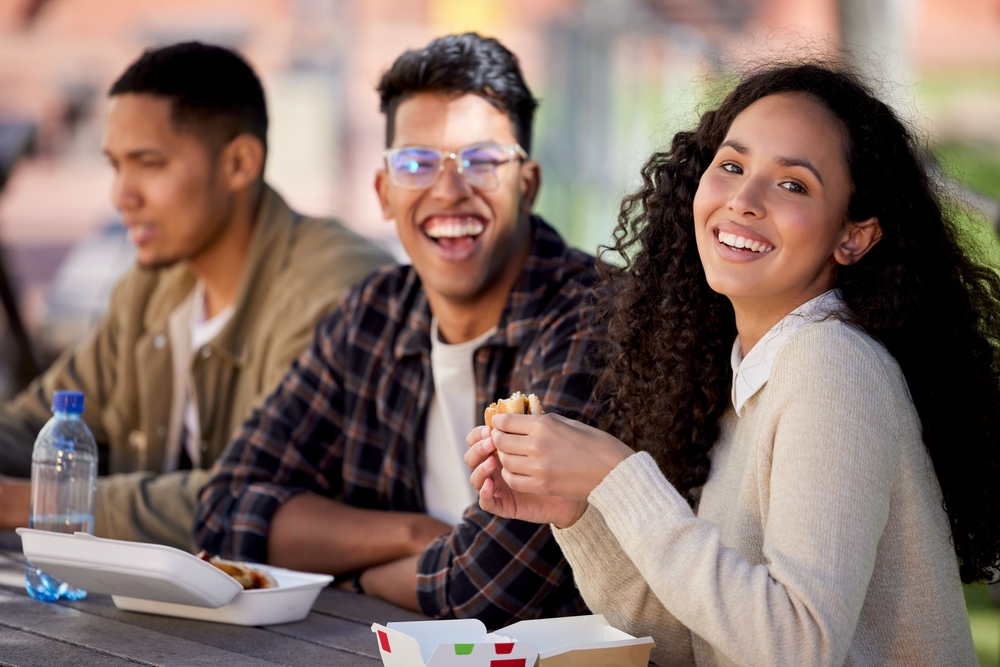 Students,,Happy,And,Friends,Eating,Lunch,Together,On,University,Or